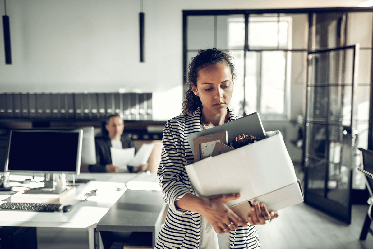 Worker walking away from desk after being dismissed