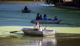 Mother and daughter rowing a boat