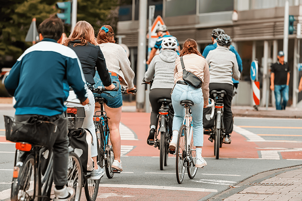 Image of a group of cyclists crossing at a street junction.
