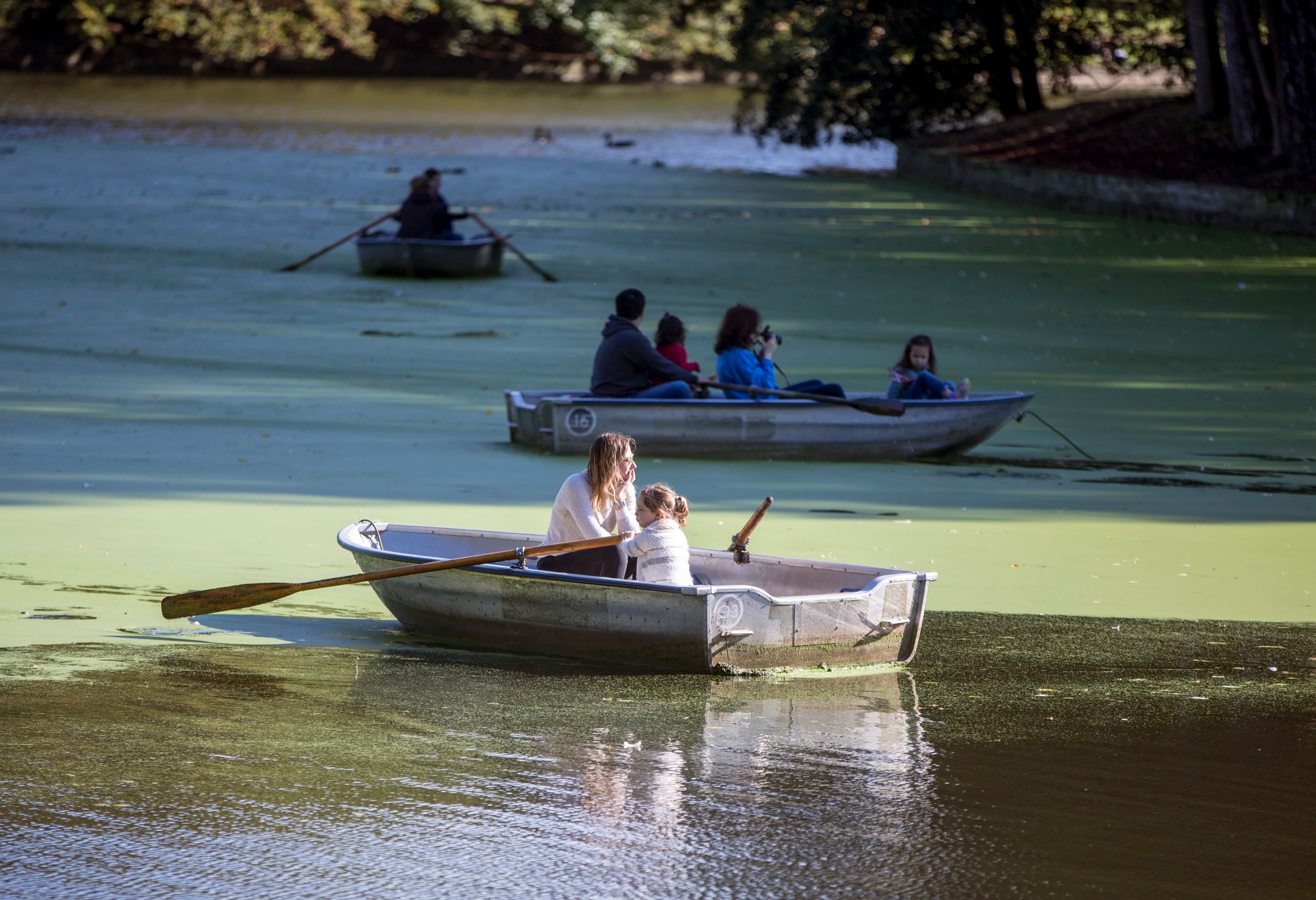 Mother and daughter rowing a boat