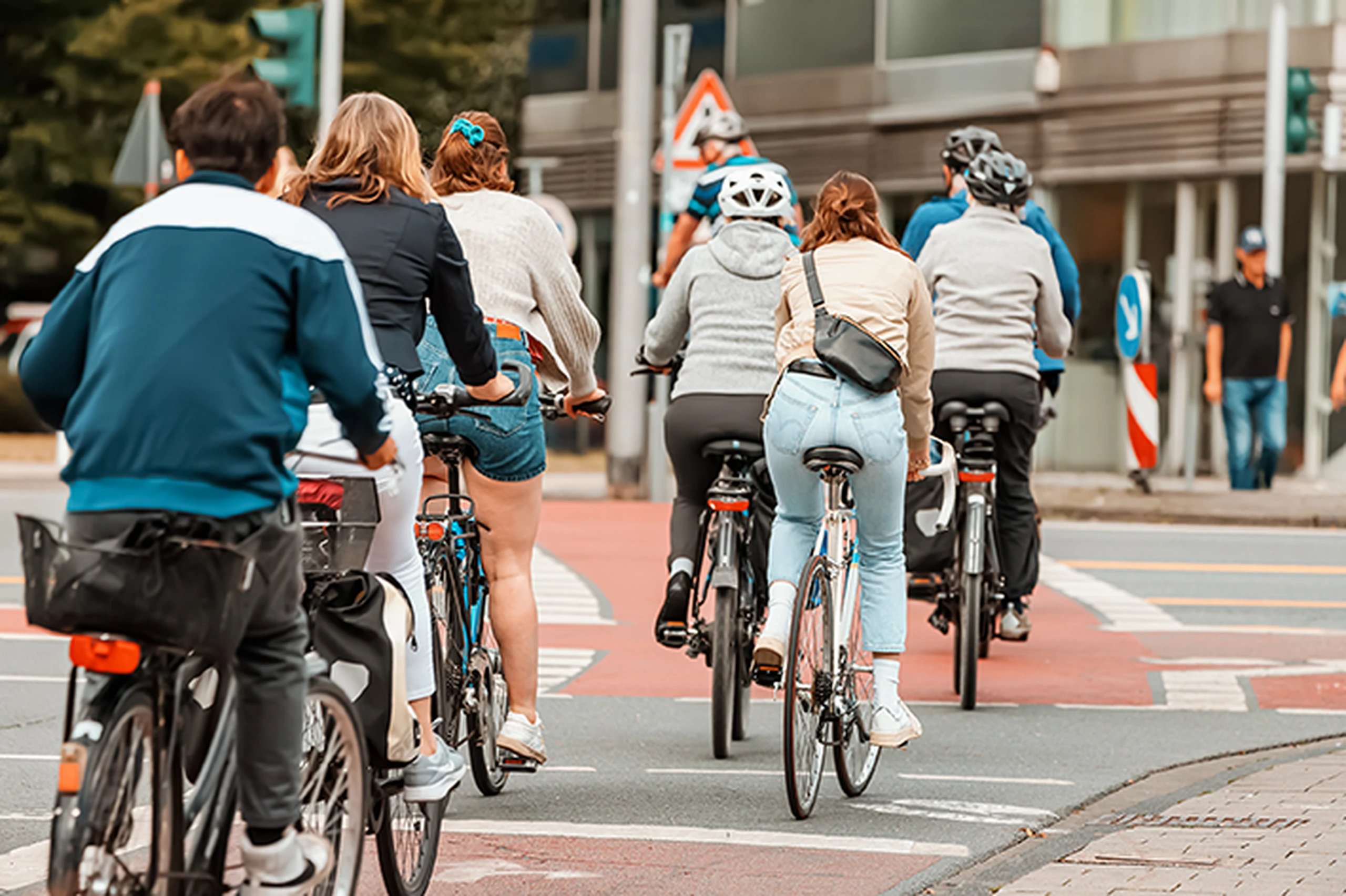 Image of a group of cyclists crossing at a street junction.
