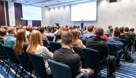Conference taking place in a large conference room