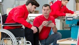 Disabled worker in carpenters workshop