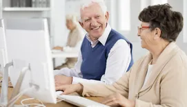 Retirees learning computer skills