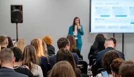 Group of people listening to a presentation