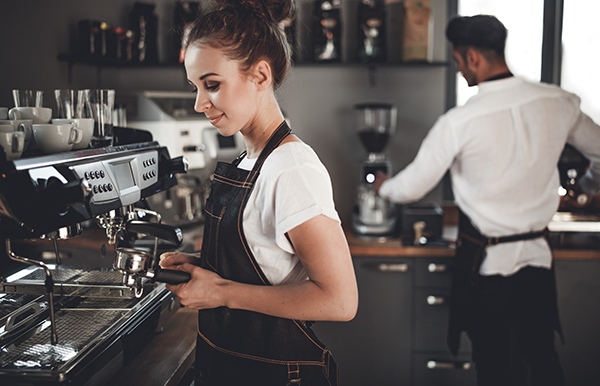 Image of young female worker in a café