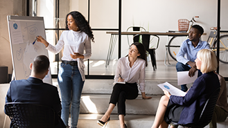 Shutterstock image of group of employees sharing ideas