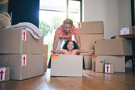 Happy dad, excited kid play in cardboard boxes in new house © Davids C/peopleimages.com/Adobe Stock