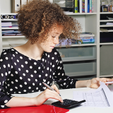 Image of young woman working in an office